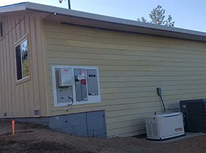 Front view of a modern two-story home with freshly installed James Hardie™ HardiePlank® siding in Arctic White, featuring clean trim and new windows.
